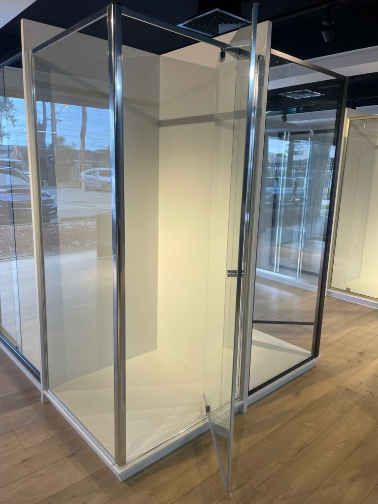 Custom glass shower enclosure with minimalist aluminium frame design