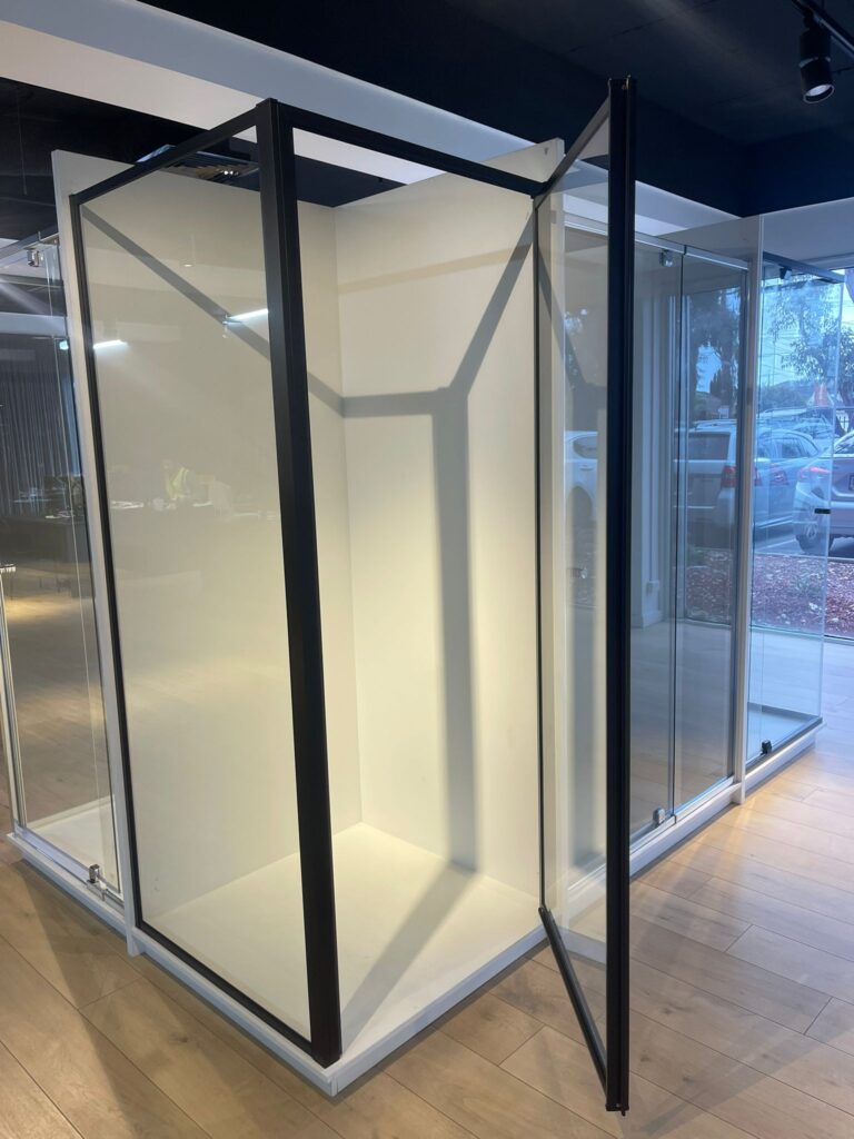 Premium glass shower cabin featuring sleek black framing